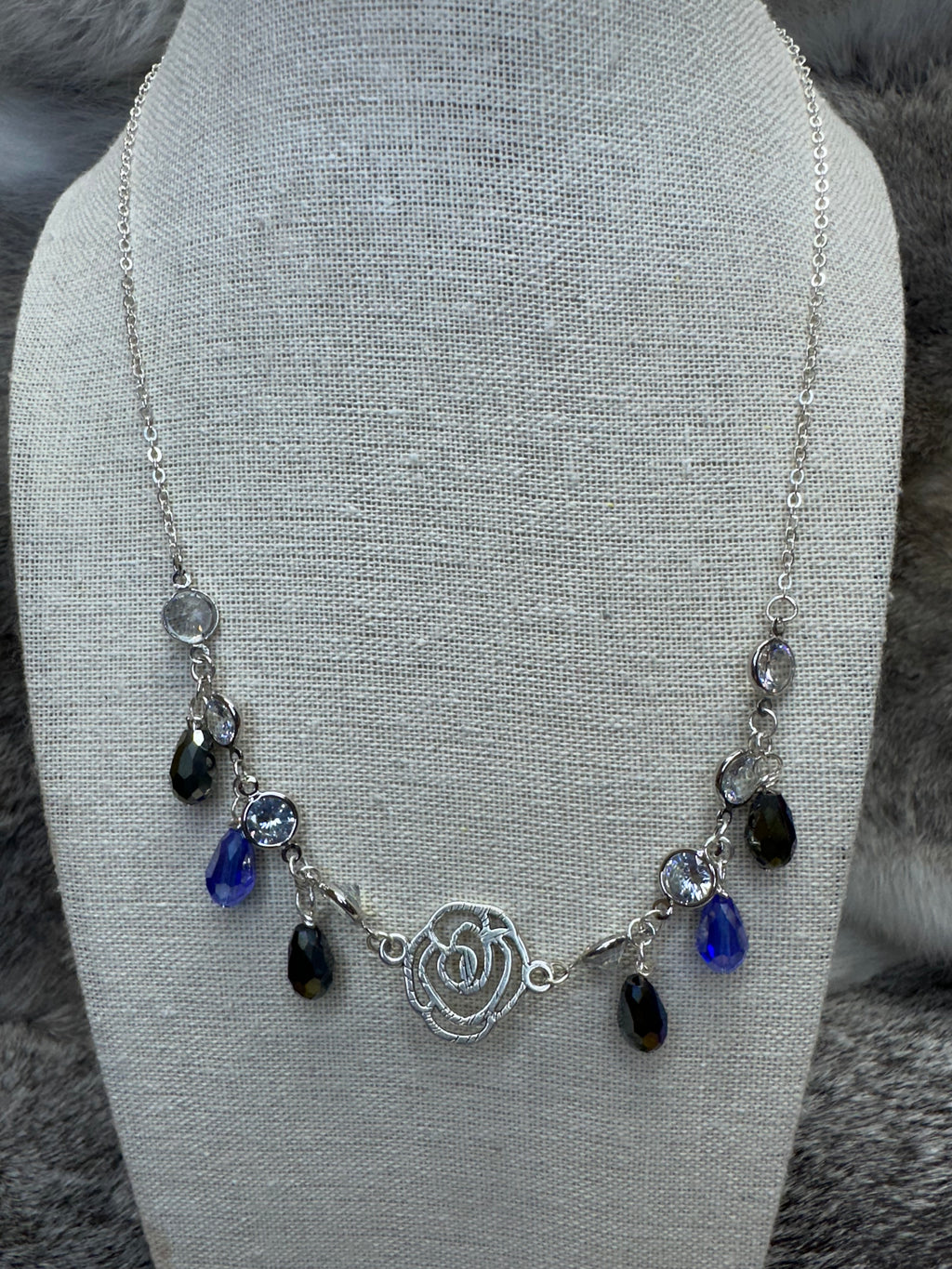Cut out Rose Necklace with Blue and Clear Crystal Dangles