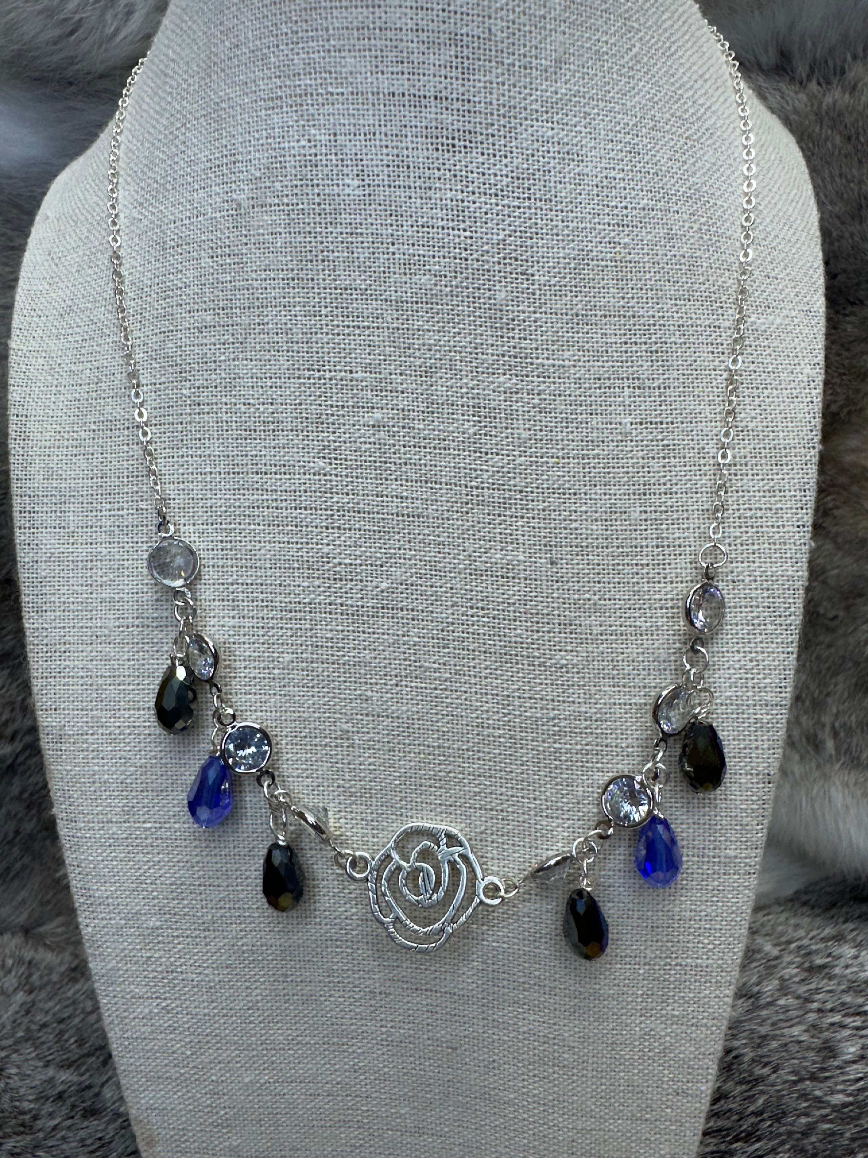 Cut out Rose Necklace with Blue and Clear Crystal Dangles