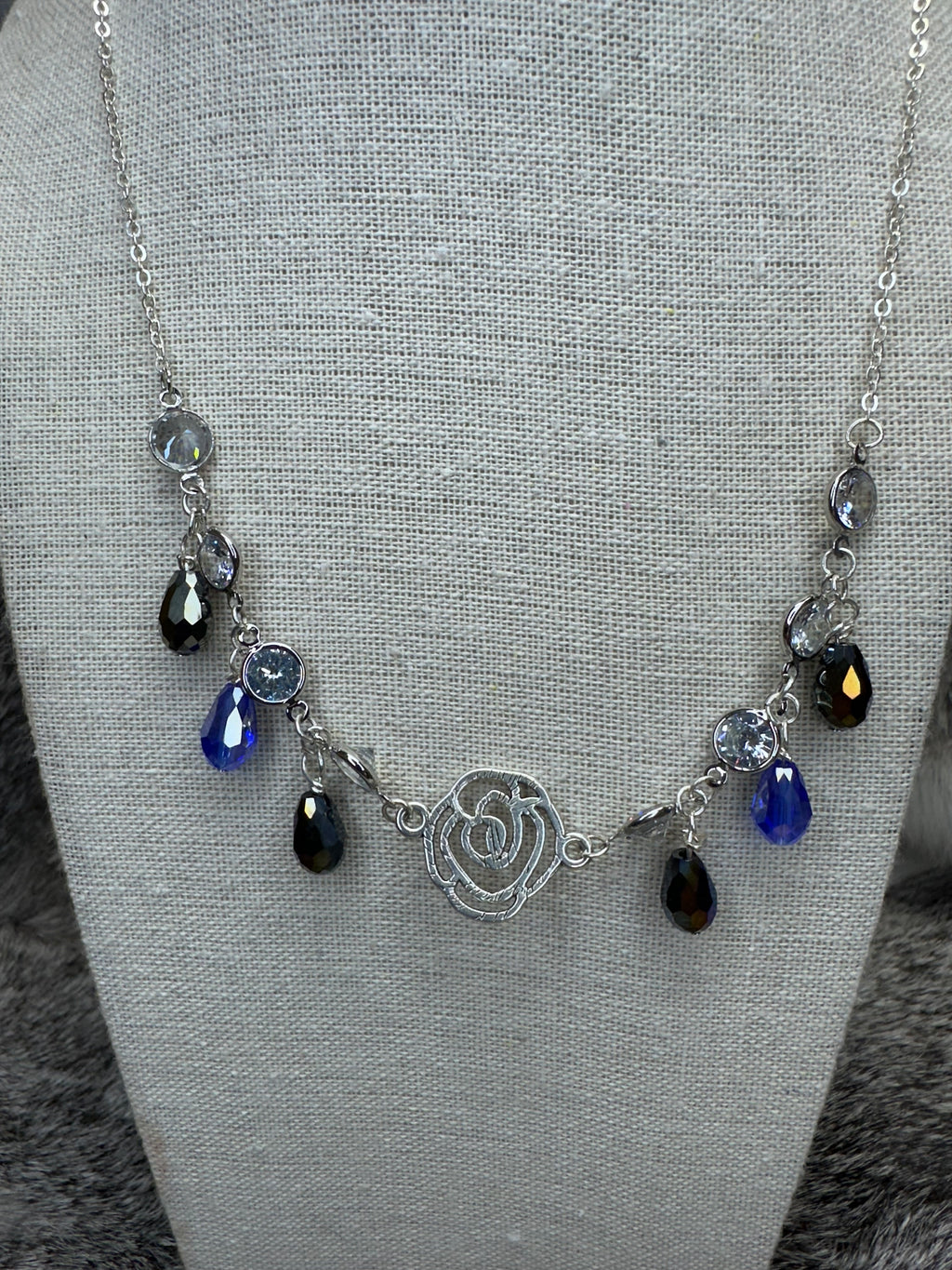 Cut out Rose Necklace with Blue and Clear Crystal Dangles