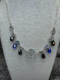 Cut out Rose Necklace with Blue and Clear Crystal Dangles