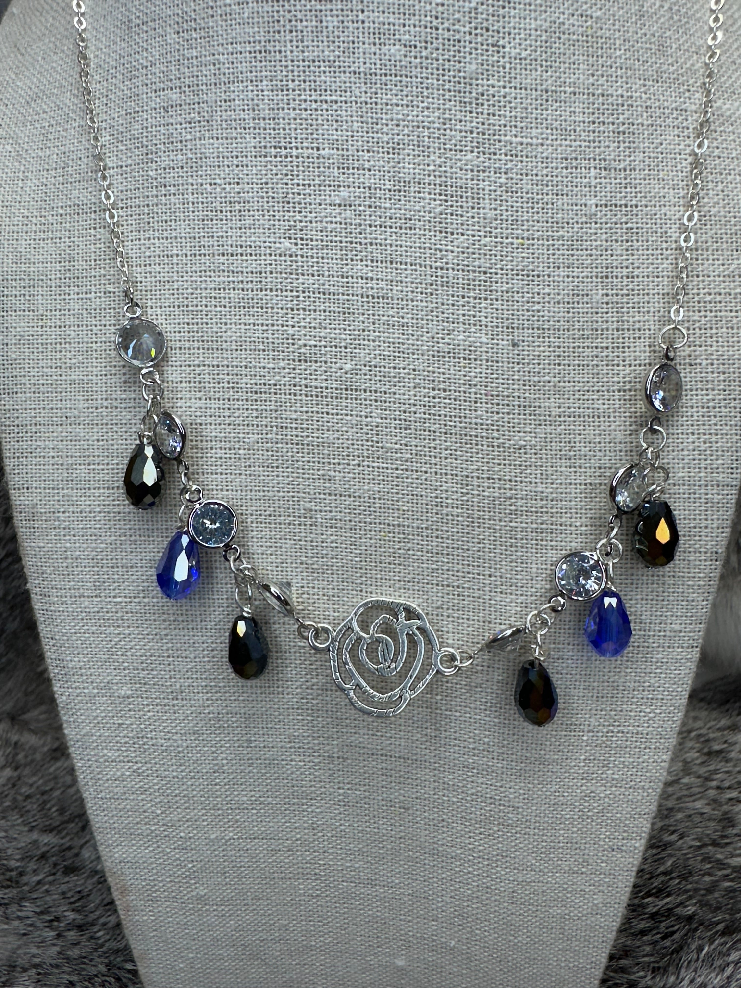 Cut out Rose Necklace with Blue and Clear Crystal Dangles